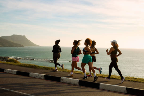 Group of adults running outdoors, representing muscle endurance, physical activity, and functional health benefits associated with L-Carnosine